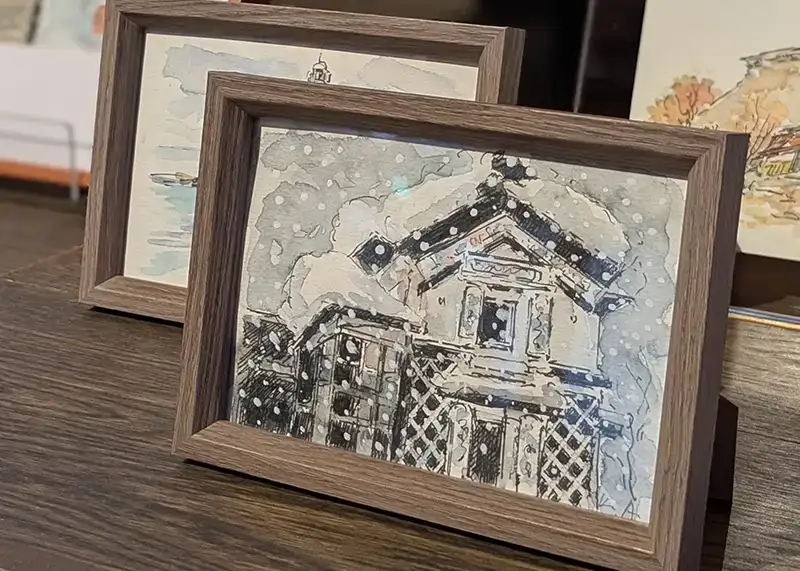 米蔵に展示された青柳謹一さんの額装水彩画